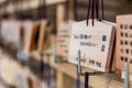 Ema tablets, Japanese wooden wishing board, hang on racks at temple in Tokyo, Japan on June 14, 2015