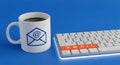 Email Communication Setup with Keyboard and Mug Royalty Free Stock Photo