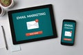 Email marketing concept on tablet and smartphone screen Royalty Free Stock Photo