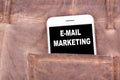 Email Marketing. Smartphone in jeans pocket. Technology business and communication, advertising background