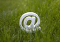 Email sign on green grass Royalty Free Stock Photo