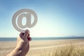 Email at symbol on the beach summer background Royalty Free Stock Photo