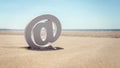 Email at symbol in the sand at the beach Royalty Free Stock Photo