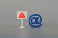 Email symbol and warning sign. concept of internet spam, fraud, email hacking
