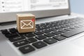 New email symbol on wooden block on laptop keyboard Royalty Free Stock Photo