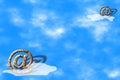 Email symbols over blue sky