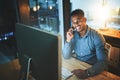 The email you sent looks good. a handsome young businessman making a phonecall while working late at night in a modern Royalty Free Stock Photo