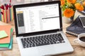 Emails list on a laptop screen on an office desk Royalty Free Stock Photo