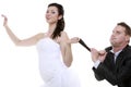 Emancipation idea. Woman pulling on mans tie, funny couple