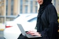 Emarati Arab Business woman using laptop computer