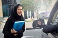 Emarati Arab Business women getting into the car