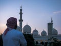 Emarati man looking at Sheikh Zayed Grand mosque