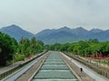 Embankment of the river against the backdrop of mountains. River against the backdrop of mountains.