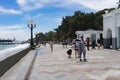 Embankment of the city in the summer with vacationers and tourists