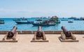 Embankment with guns in Zanzibar Stone Town with ocean on the ba