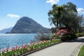Embankment of the lake Lugano with flowering tulips. Lugano, Switzerland Royalty Free Stock Photo