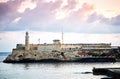 Embankment Malecon view ocean El Morro fortress lamp road sidewalk dawn Royalty Free Stock Photo