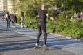 Embankment of the Moscow River, man on rollers learn to ride, in full gear