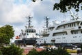 Embankment of the naval military port. Military ships on the pier. Ships moored to the shore