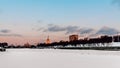 Embankment near Moscow City. Dawn on the Moscow River in winter. Moscow river covered by snow, wintry landscape Royalty Free Stock Photo
