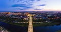 The embankment, the Neman river and the Old bridge in Grodno. Autumn ,evening, the city in the sunshine against a Royalty Free Stock Photo