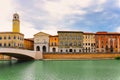 Embankment of The River Arno in The Italian City of Pisa. River Arno quietly passing through Pisa, Italy. Lungarno is the name Royalty Free Stock Photo