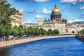 The embankment of the river Moika, St. Isaac`s Cathedral at sunset in autumn in St. Petersburg