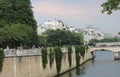 Embankment of the river Seine near Notre Dame. View of the houses of the island of Saint-Louis.