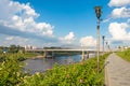 Embankment of the river with stairs and street lights at the summer. Royalty Free Stock Photo