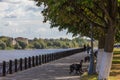 Embankment of the river Volga in Tver, Russia. Autumn Sunny day. Passers-by walking on the street