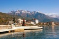 Embankment of Tivat city with Lovcen mountain in the background on sunny winter day.  Montenegro, Bay of Kotor Royalty Free Stock Photo