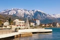 Embankment of Tivat town with Lovcen mountain in the background. Bay of Kotor, Montenegro, winter Royalty Free Stock Photo