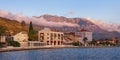 Embankment of Tivat town with the mountain of Lovchen in the background before sunset. Bay of Kotor, Montenegro, autumn Royalty Free Stock Photo