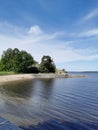 The embankment of the Vyborg Bay with a pier, stairs and a Tea gazebo at the top in the Monrepos Park of the city of Vyborg Royalty Free Stock Photo