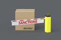 Cardboard boxes and barrier with word sanctions. Delivery ban. Cargo restriction