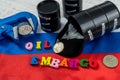 Embargo on Russian oil with ruble coin held in a vise on national flag