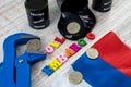 Embargo on Russian oil with ruble coin held in a vise on national flag