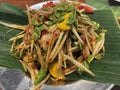 Sensational Thai Delight: Papaya Salad with Fermented Fish, Salted Crab, and Acacia Seed Topping