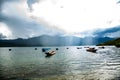 Lugu Lake Tranquility: Discovering the Serene Beauty of China\'s Highlands, sunrise boats