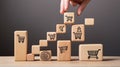 Strategic Stacking: Hand Arranging Wood Blocks with Iconic Grace