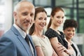 Embarking on success together. Portrait of a group of businesspeople standing together in a modern office. Royalty Free Stock Photo