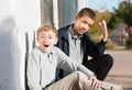 Embarrassed teen with friend reacting shamefully Royalty Free Stock Photo