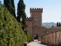 Embattled Tower of the Medieval Castle at the Entrance to the Village of Bolgheri Royalty Free Stock Photo