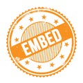 EMBED text written on orange grungy round stamp