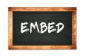 EMBED text written on wooden frame school blackboard