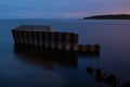 Embedded stones and harbor ruins in Narva-JÃÂµesuu. Rocky beach, peaceful sea and port.