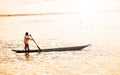 Embera Indian rowing his canoe