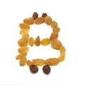 Emblem of bitcoin from raisins, on white isolated background