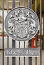Emblem on the entrance gate of King's College in London, UK