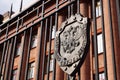 Emblem of the FSB of Russia on the fence